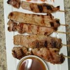 Best A14. Moo Ping (Grilled-Honey Pork) (4 Pcs) in Lincoln City, OR